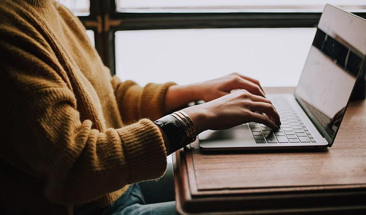 female-typing-on-laptop